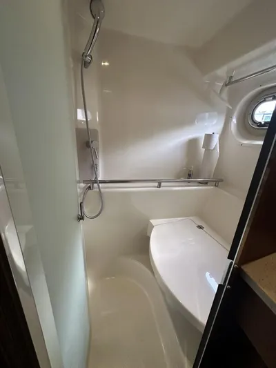 2008 Tiara 3500 Sovran Yacht Photos Pics 2008 Tiara Yachts 3500 Sovran bathroom with shower and porthole window.