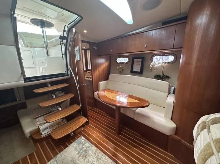 2008 Tiara 3500 Sovran Yacht Photos Pics 2008 Tiara Yachts 3500 Sovran interior with wooden flooring, cozy seating, and elegant design.