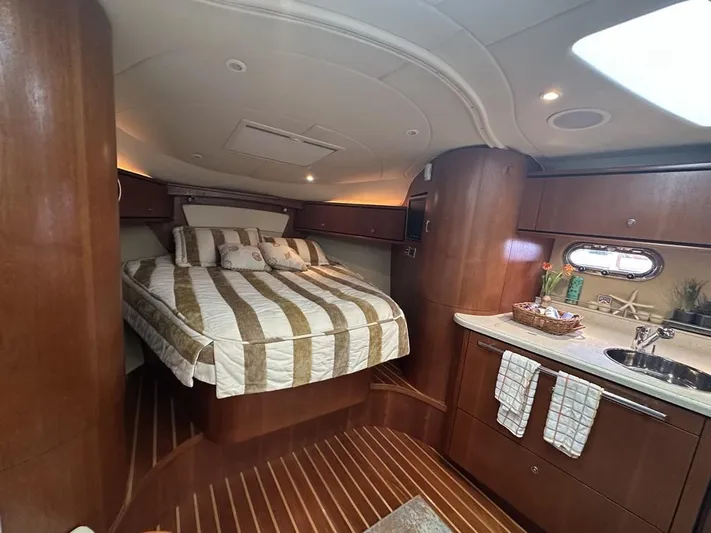 2008 Tiara 3500 Sovran Yacht Photos Pics Luxurious interior of 2008 Tiara Yachts 3500 Sovran with cozy bed and kitchenette.