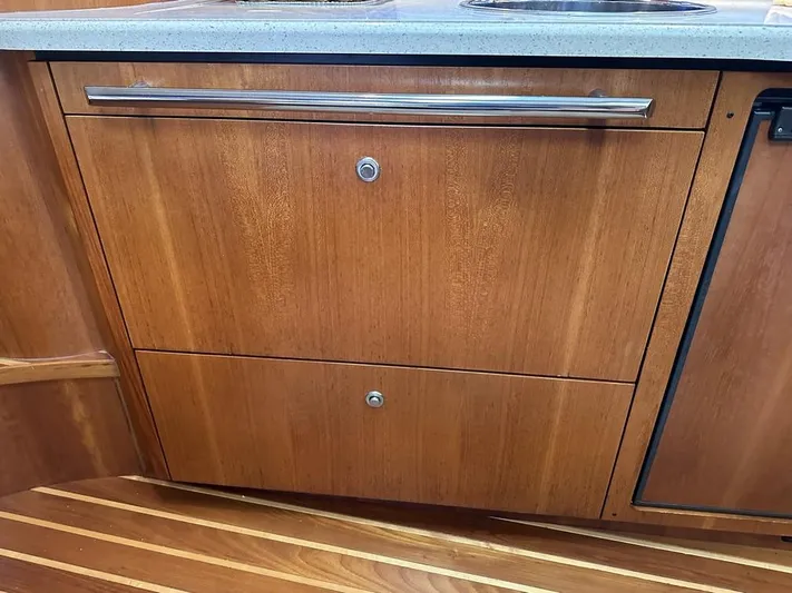 2008 Tiara 3500 Sovran Yacht Photos Pics 2008 Tiara Yachts 3500 Sovran interior with wooden cabinetry and sleek countertop.