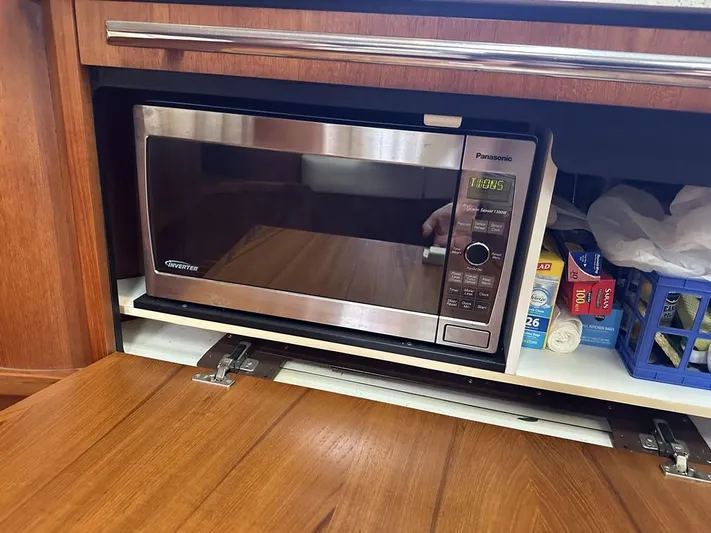 2008 Tiara 3500 Sovran Yacht Photos Pics Microwave in 2008 Tiara Yachts 3500 Sovran kitchen with wooden cabinetry.