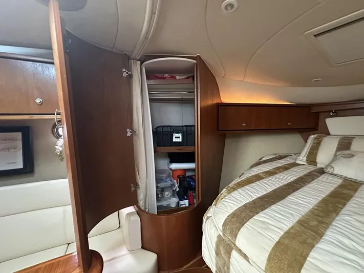 2008 Tiara 3500 Sovran Yacht Photos Pics 2008 Tiara Yachts 3500 Sovran cabin interior with open closet and bed.