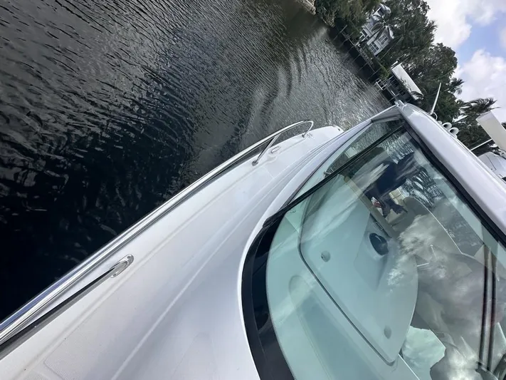 2008 Tiara 3500 Sovran Yacht Photos Pics 2008 Tiara Yachts 3500 Sovran cruising on calm waters near a shoreline.