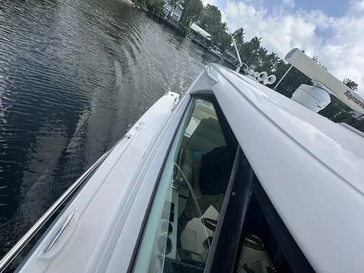 2008 Tiara 3500 Sovran Yacht Photos Pics 2008 Tiara Yachts 3500 Sovran cruising on a calm waterway.