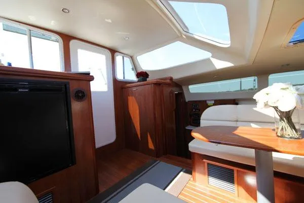 Rockstar Yacht Photos Pics Interior of 2013 Gemini Legacy yacht with elegant wood finish and skylights.