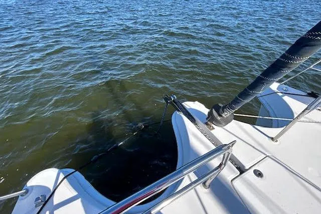 Rockstar Yacht Photos Pics Catamaran deck on water, Gemini Legacy 2013, with visible railing and mast.