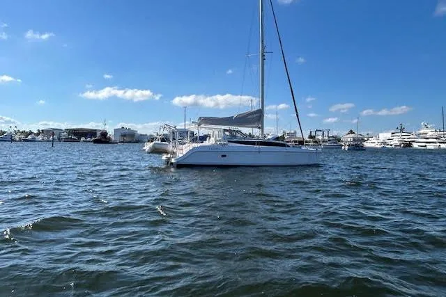 Rockstar Yacht Photos Pics Sailboat Gemini Legacy 2013 on calm waters under a clear blue sky.