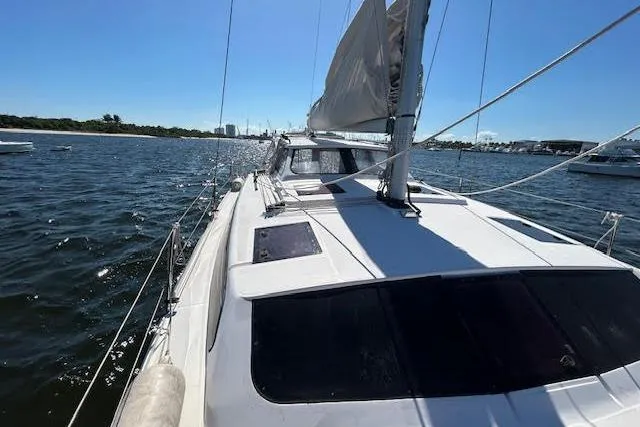 Rockstar Yacht Photos Pics Sailing yacht Gemini Legacy 2013 on open water under clear blue sky.