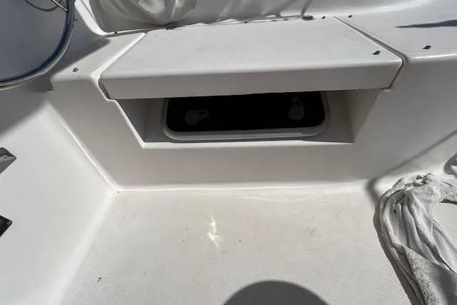 Rockstar Yacht Photos Pics 2013 Gemini Legacy boat interior with storage compartment and seating area.