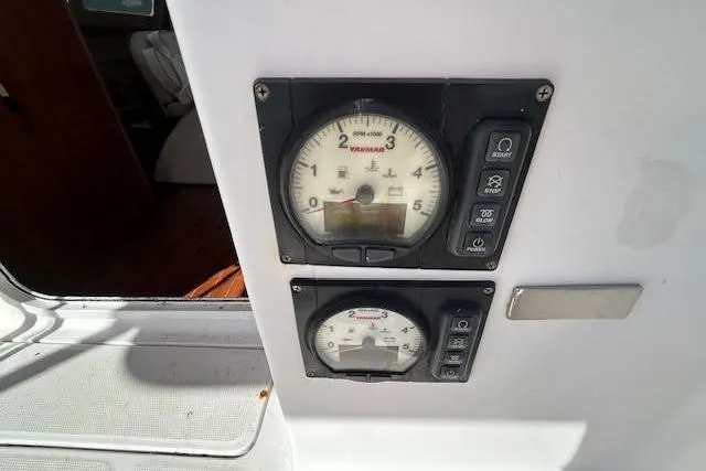 Rockstar Yacht Photos Pics Control panel of a 2013 Gemini Legacy boat with gauges and buttons.