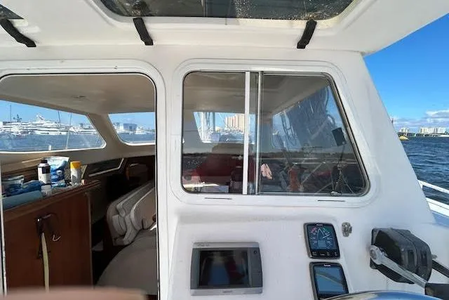 Rockstar Yacht Photos Pics Interior view of 2013 Gemini Legacy boat with navigation equipment and ocean backdrop.