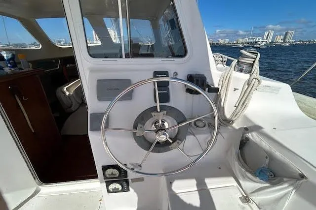 Rockstar Yacht Photos Pics Helm of 2013 Gemini Legacy boat with steering wheel and navigation equipment.