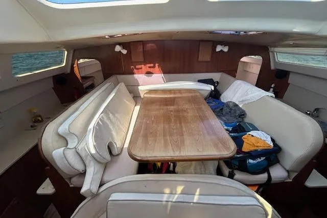 Rockstar Yacht Photos Pics Interior of 2013 Gemini Legacy boat with dining area and seating.