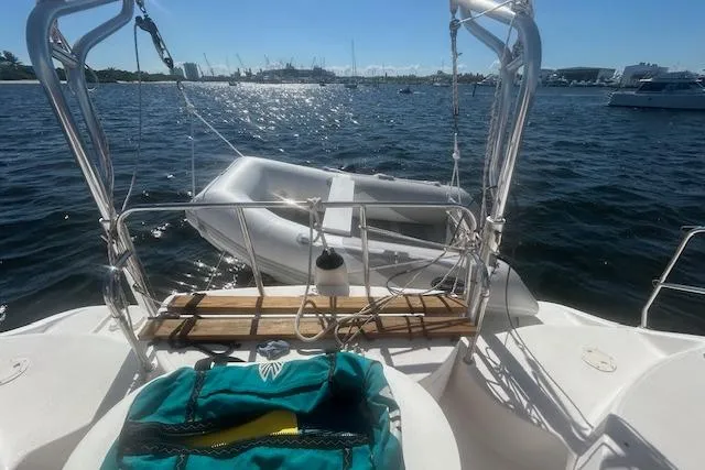 Rockstar Yacht Photos Pics Sailboat deck view with dinghy on water, Gemini Legacy 2013 model.