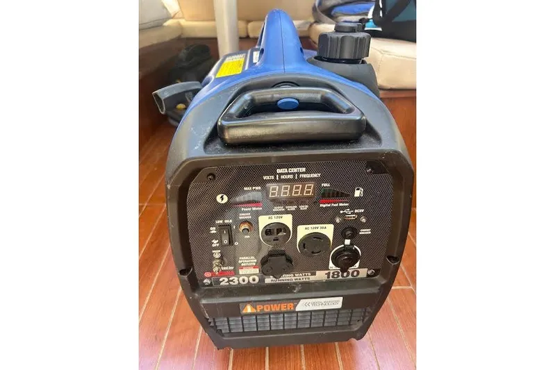 Rockstar Yacht Photos Pics Portable Gemini Legacy 2013 generator with control panel and power outlets on wooden floor.