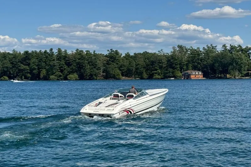  Yacht Photos Pics 2016 Formula 353 FASTech speedboat cruising on a lake with scenic forest backdrop.