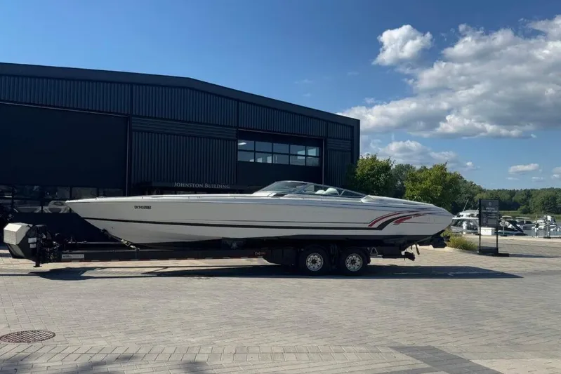  Yacht Photos Pics 2016 Formula 353 FASTech boat on trailer, parked outside a building under a clear sky.