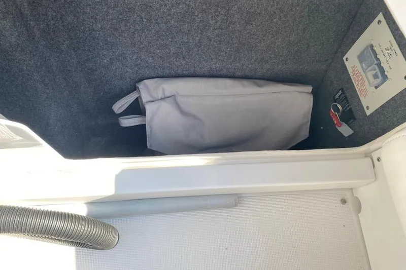  Yacht Photos Pics 2016 Formula 353 FASTech storage compartment with gray bag and control panel.
