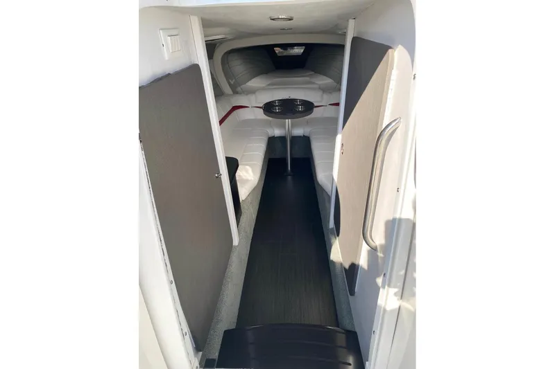  Yacht Photos Pics 2016 Formula 353 FASTech cabin interior with white seating and small table.