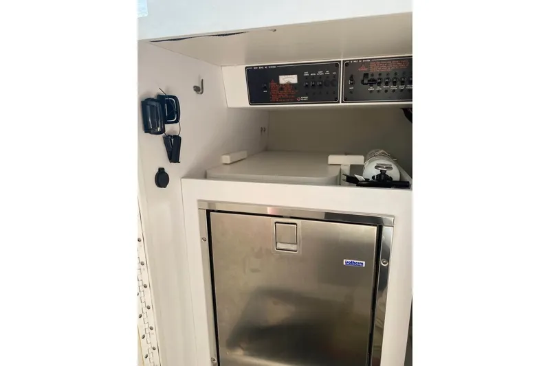  Yacht Photos Pics 2016 Formula 353 FASTech interior with control panels and stainless steel fridge.