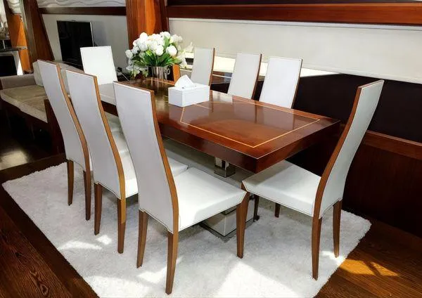  Yacht Photos Pics Luxurious dining area on 2018 Galeon 780 Crystal yacht with elegant table and chairs.