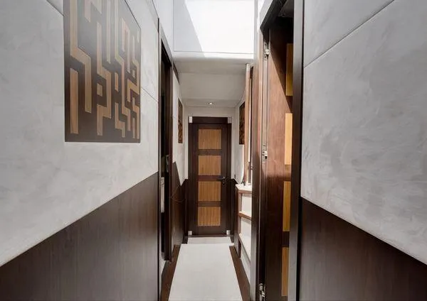  Yacht Photos Pics Interior hallway of 2018 Galeon 780 Crystal yacht, featuring modern wood paneling and sleek design.