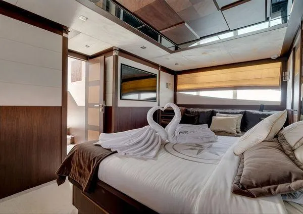  Yacht Photos Pics Luxurious bedroom interior on 2018 Galeon 780 Crystal yacht with elegant decor and swan towel art.