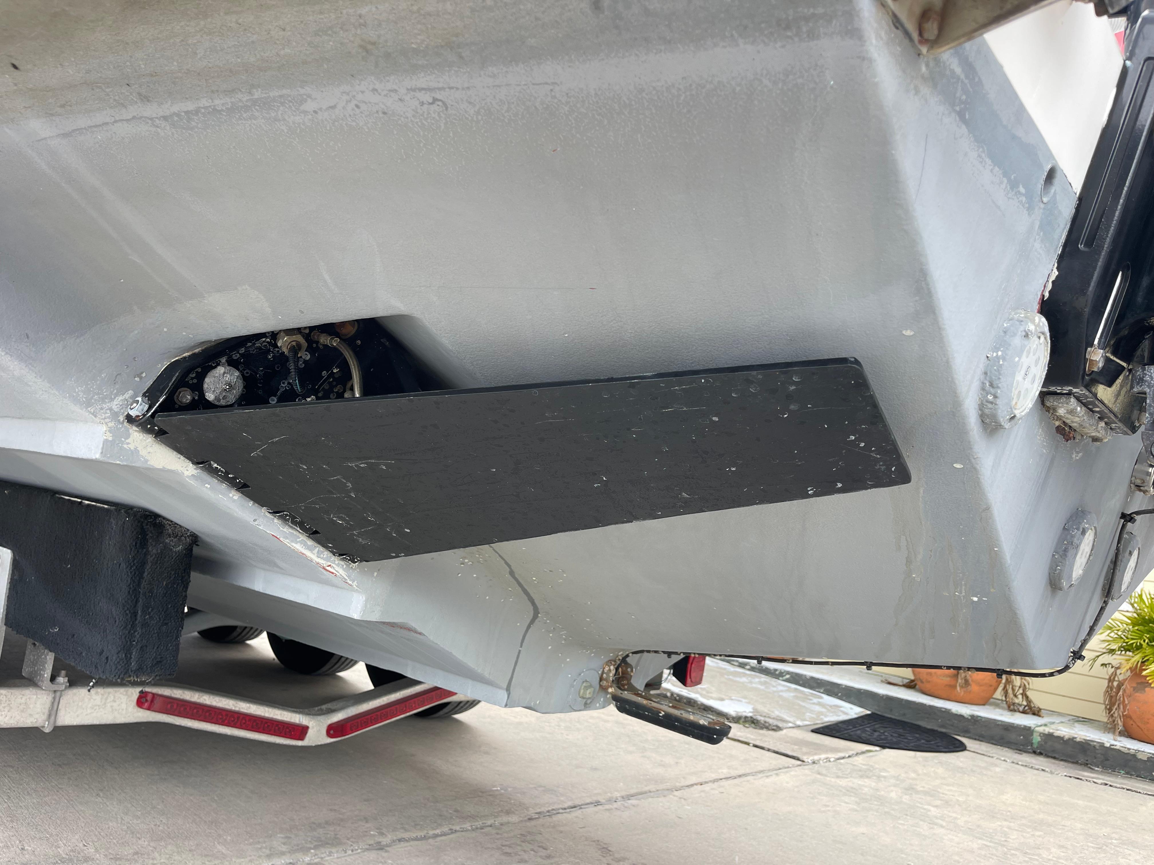 1999 Venture 34 Center Console boat hull on trailer, close-up view.
