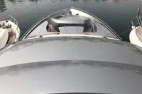 2008 Pershing 90 yacht bow view, docked in calm waters.