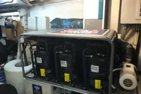 Engine room of a 2008 Pershing 90 yacht with machinery and equipment.