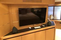 Luxury interior of 2008 Pershing 90 yacht with modern TV and speakers.