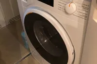 Miele washing machine in a 2008 Pershing 90 yacht interior.