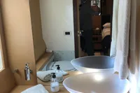 Luxurious bathroom interior of a 2008 Pershing 90 yacht with modern fixtures.