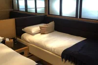 Luxurious cabin interior of a 2008 Pershing 90 yacht with twin beds.