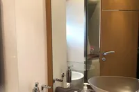 Luxurious bathroom interior of 2008 Pershing 90 yacht with modern fixtures and elegant design.