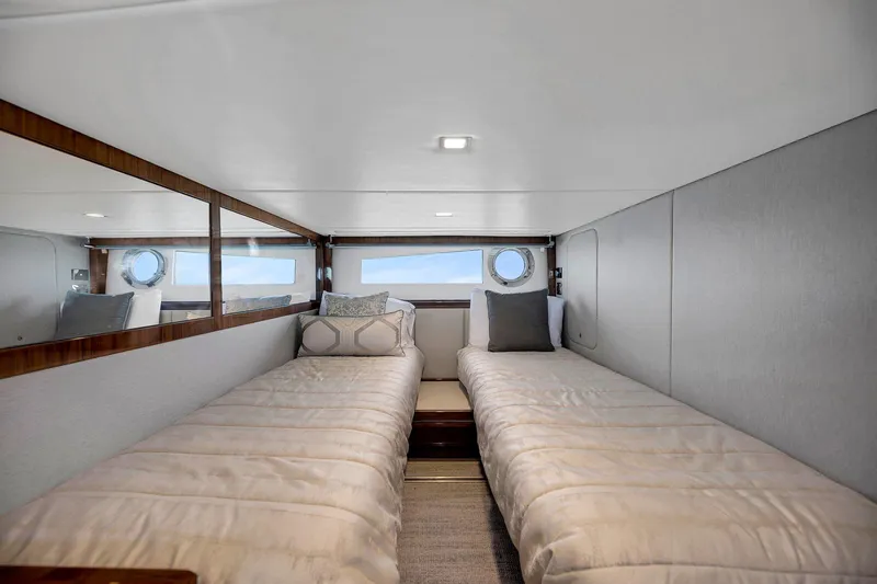  Yacht Photos Pics Interior of 2020 Riviera 4800 Sport Yacht with twin beds and modern decor.