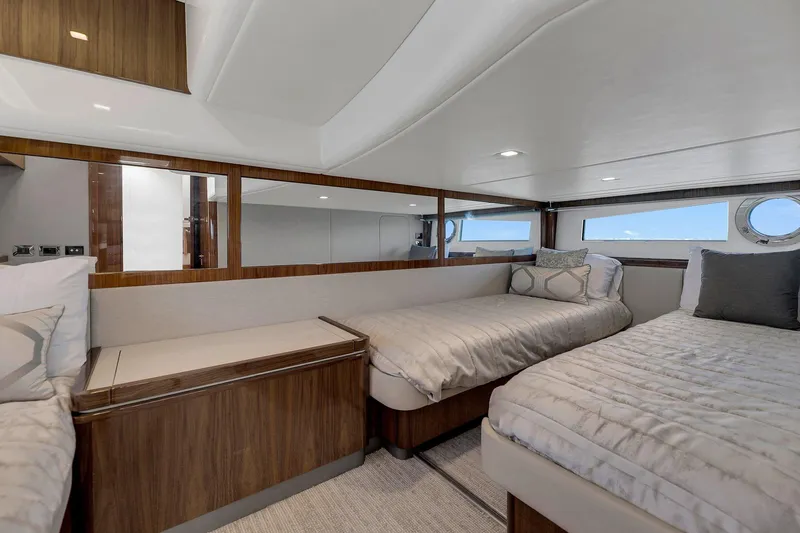  Yacht Photos Pics Interior of 2020 Riviera 4800 Sport Yacht with twin beds and modern decor.