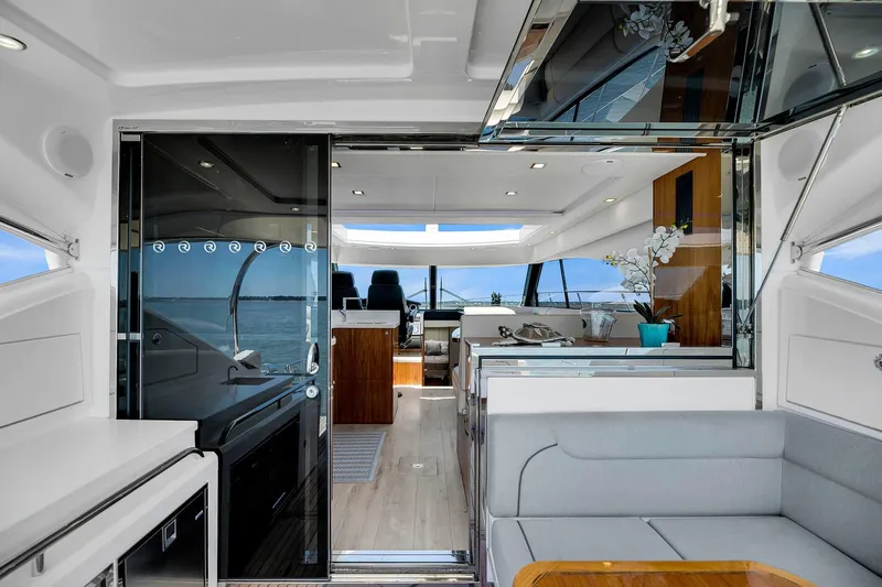  Yacht Photos Pics Luxurious interior of 2020 Riviera 4800 Sport Yacht with modern furnishings and panoramic views.
