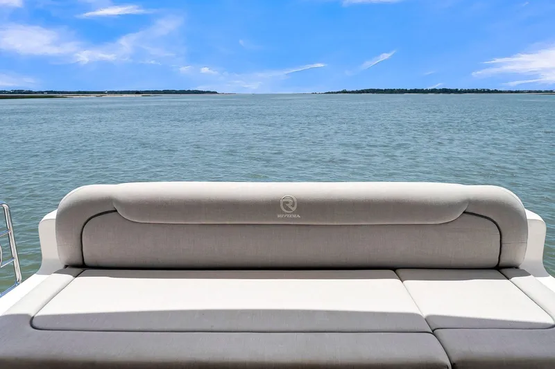  Yacht Photos Pics Riviera 4800 Sport Yacht 2020, rear seating view, overlooking serene ocean and blue sky.