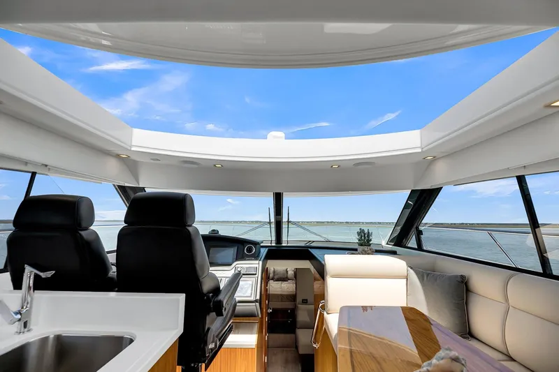  Yacht Photos Pics Interior of 2020 Riviera 4800 Sport Yacht with panoramic windows and luxurious seating.