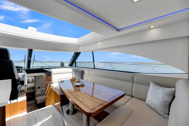  Yacht Photos Pics Luxurious interior of 2020 Riviera 4800 Sport Yacht with panoramic ocean views.