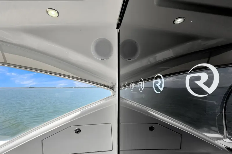  Yacht Photos Pics 2020 Riviera 4800 Sport Yacht interior with ocean view and logo reflections.