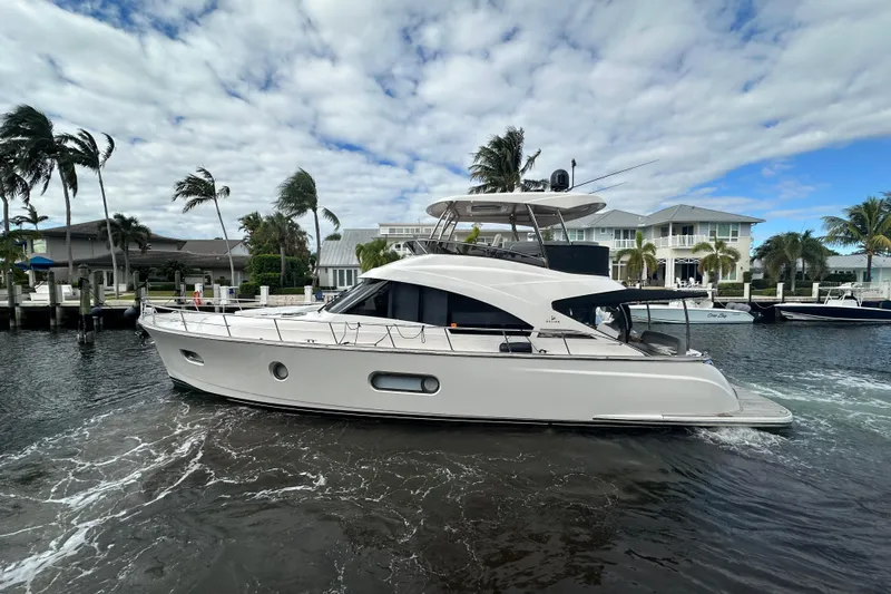 Our Trade Yacht Photos Pics Luxury Belize 54 Day Bridge yacht cruising near waterfront homes, 2023 model.
