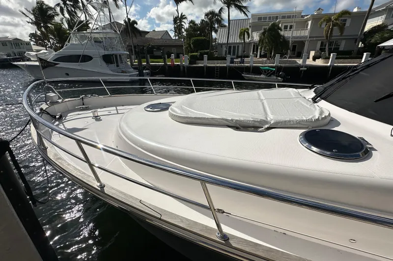 Our Trade Yacht Photos Pics Luxury yacht docked, Belize 54 Day Bridge 2023, sunny marina setting.