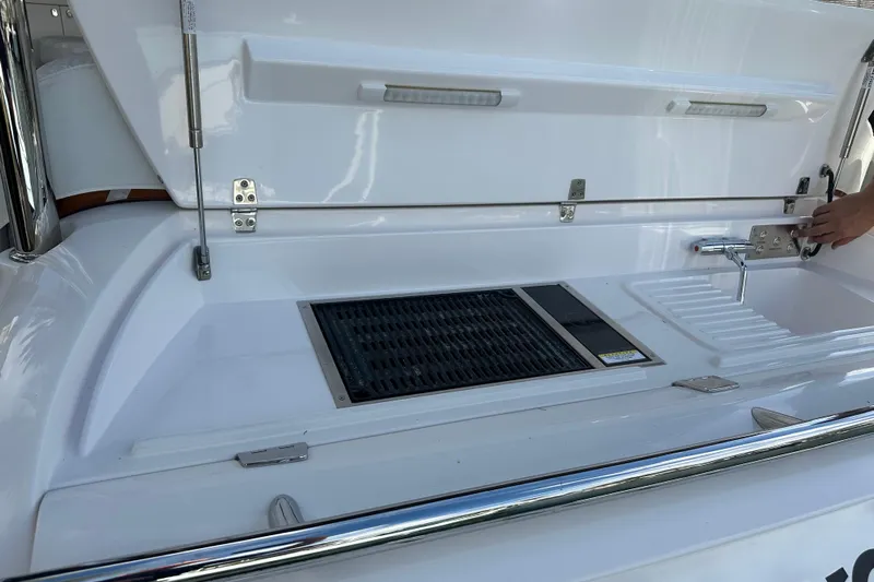 Our Trade Yacht Photos Pics Outdoor kitchen setup on 2023 Belize 54 Day Bridge yacht, featuring grill and sink.
