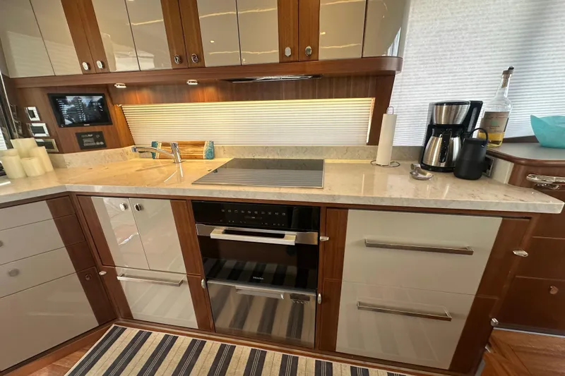 Our Trade Yacht Photos Pics Luxurious kitchen in 2023 Belize 54 Day Bridge yacht with modern appliances and sleek design.