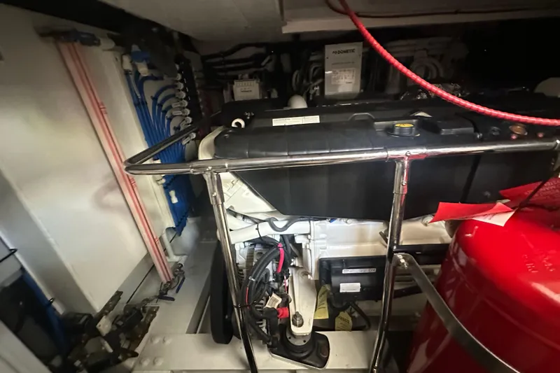 Our Trade Yacht Photos Pics Engine room of 2023 Belize 54 Day Bridge yacht, showcasing mechanical components and wiring.