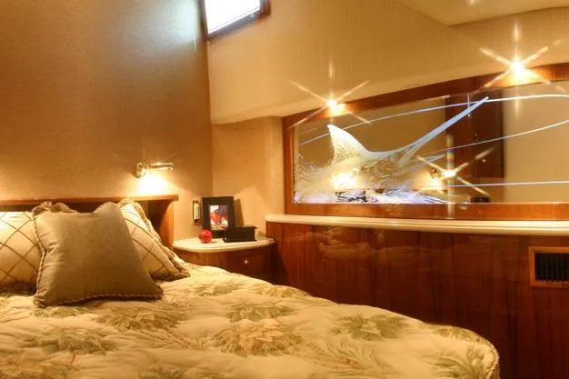  Yacht Photos Pics Luxurious cabin interior of 2026 Buddy Davis 58 Sportfisherman yacht with elegant decor.