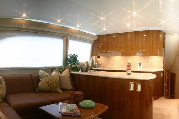  Yacht Photos Pics Luxurious interior of 2026 Buddy Davis 58 Sportfisherman yacht with elegant wood finishes.