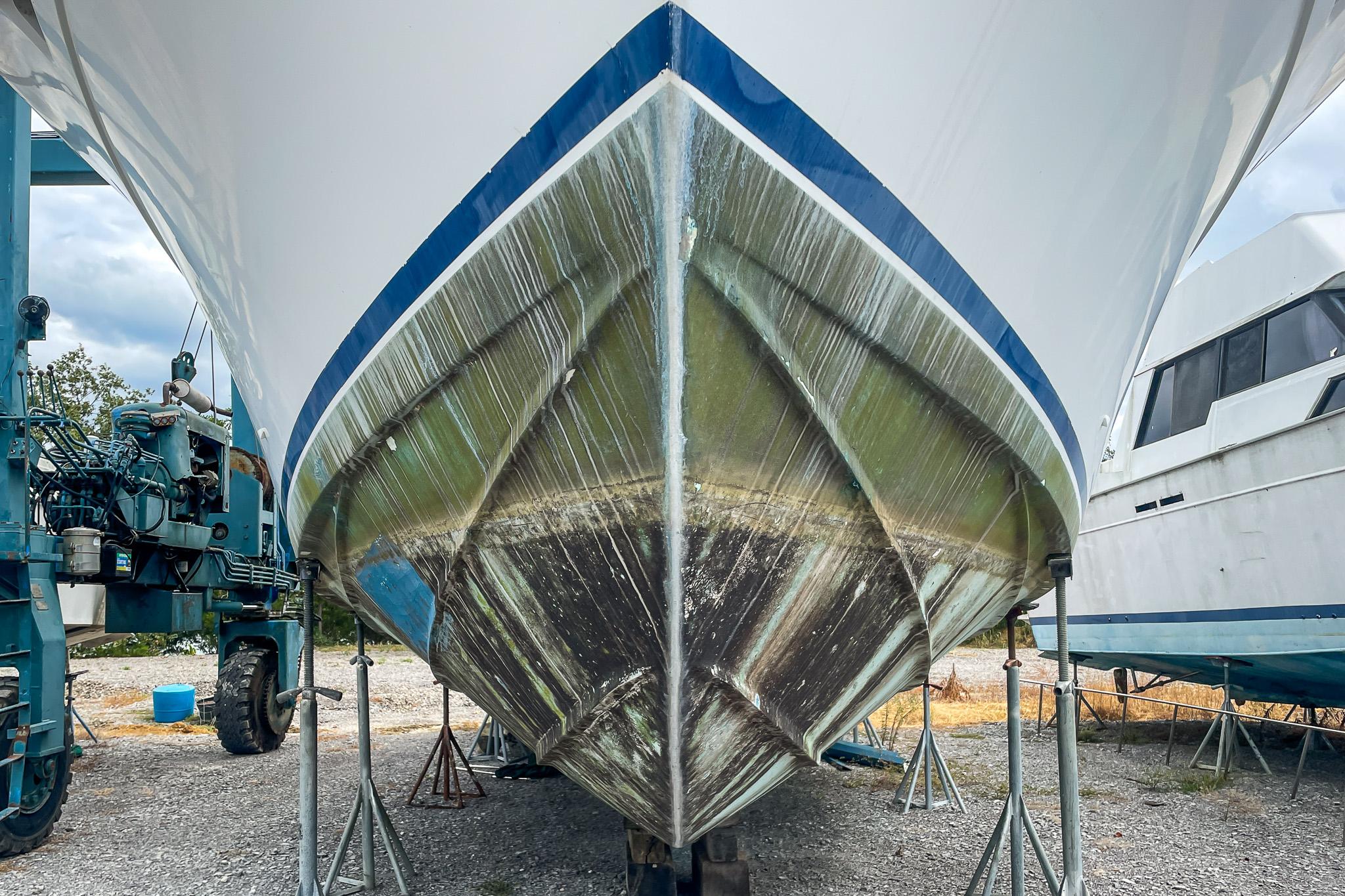 1978 Bertram 46 Convertible boat hull on dry dock, showcasing its sleek design.